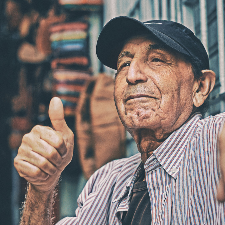 Old man gives thumbs up